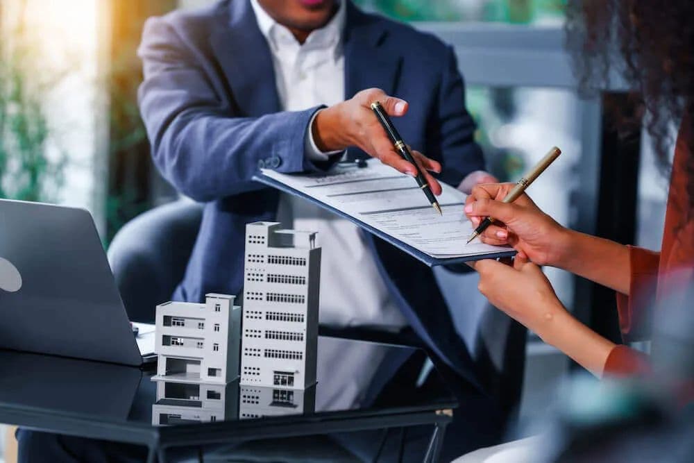 Tenant or buyer signing real-estate paperwork.