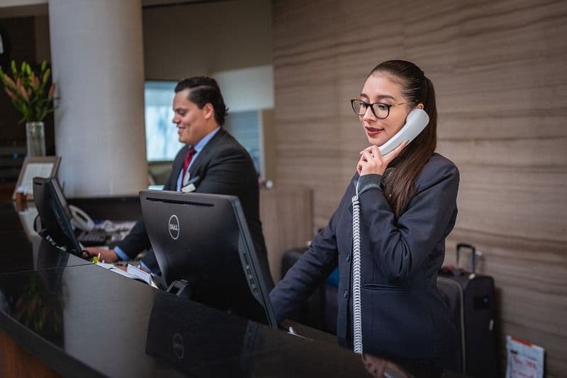 Reservations desk handling a booking call.